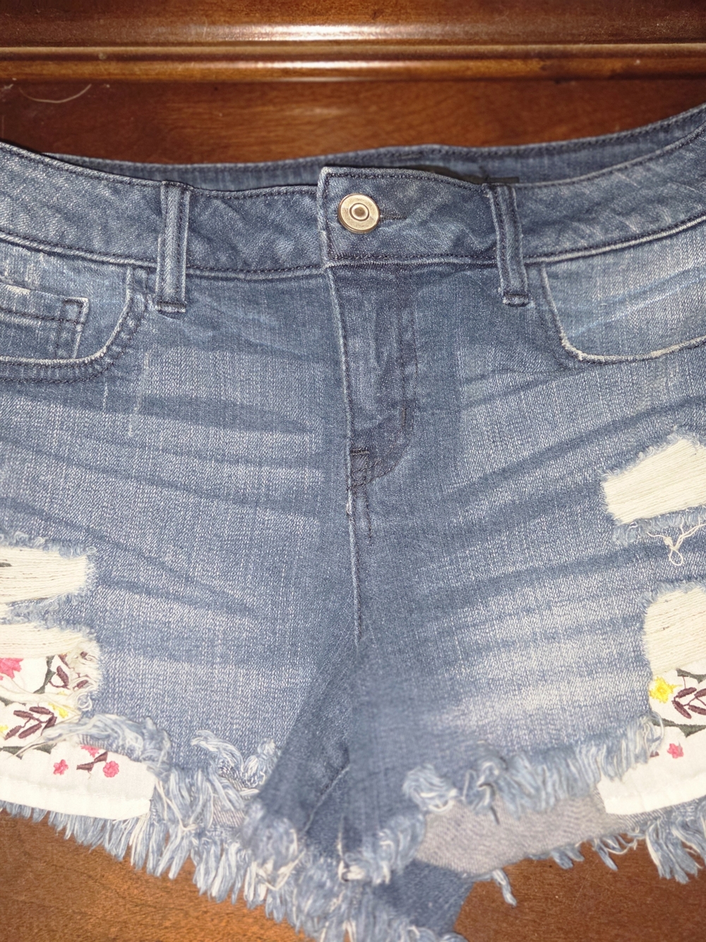 Women’s Blue Denim Distressed Shorts with Embroidered Accents
